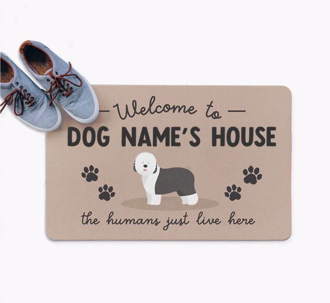 The Humans Just Live Here: Personalised {breedFullName} Doormat